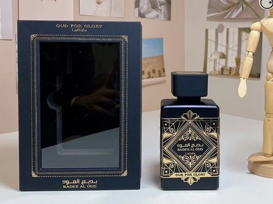 A dark perfume bottle and its box